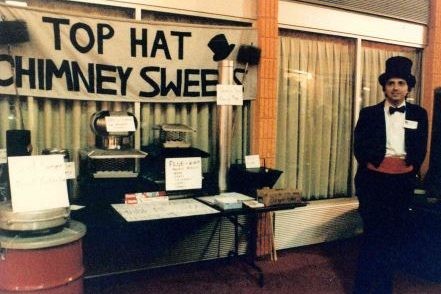 Roy, owner of Top Hat, waiting anxiously to speak to customers at his first home show about the importance of chimney sweeping and the different products and services Top Hat has available.